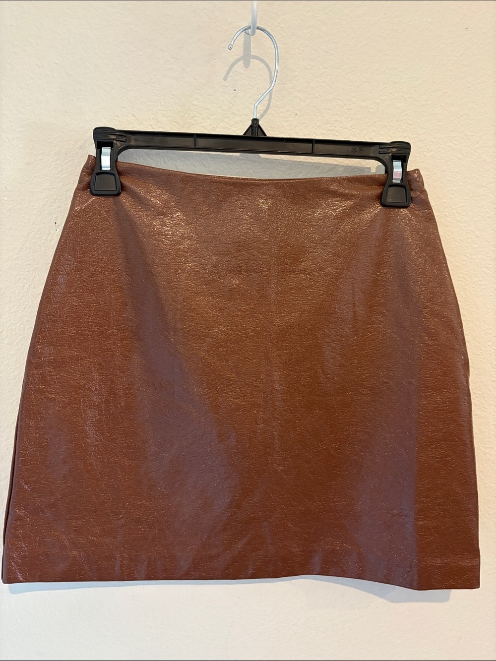 Brown Faux Leather Mini Skirt NWOT With side zip. 50% Cotton
